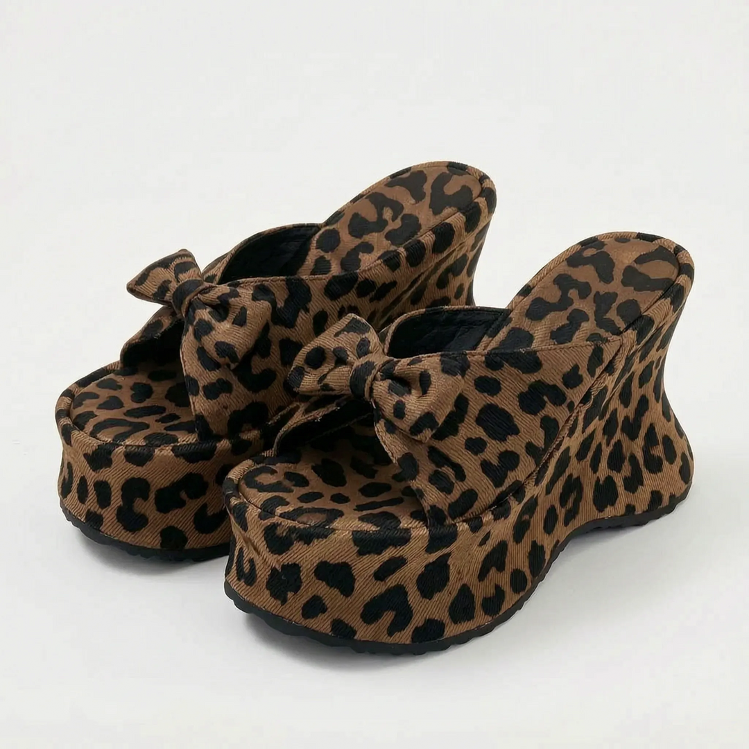 Trendy women's chunky platform sandals. High heel slip-on design, great for summer fashion & parties.