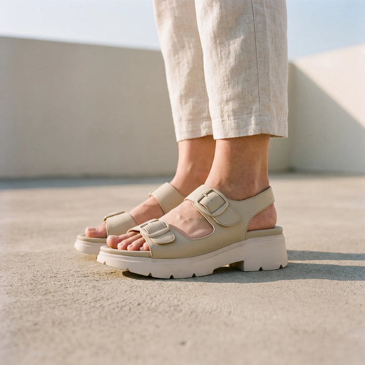 Women's chunky platform wedge sandals with adjustable strap, open toe. Chic summer footwear.