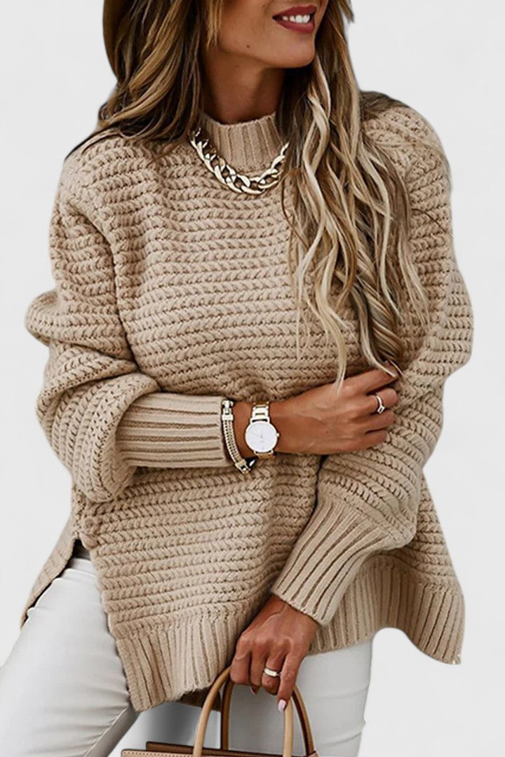 Close-up of a women's cozy chunky ribbed knit sweater, featuring a stylish mock neck for cold weather fashion.