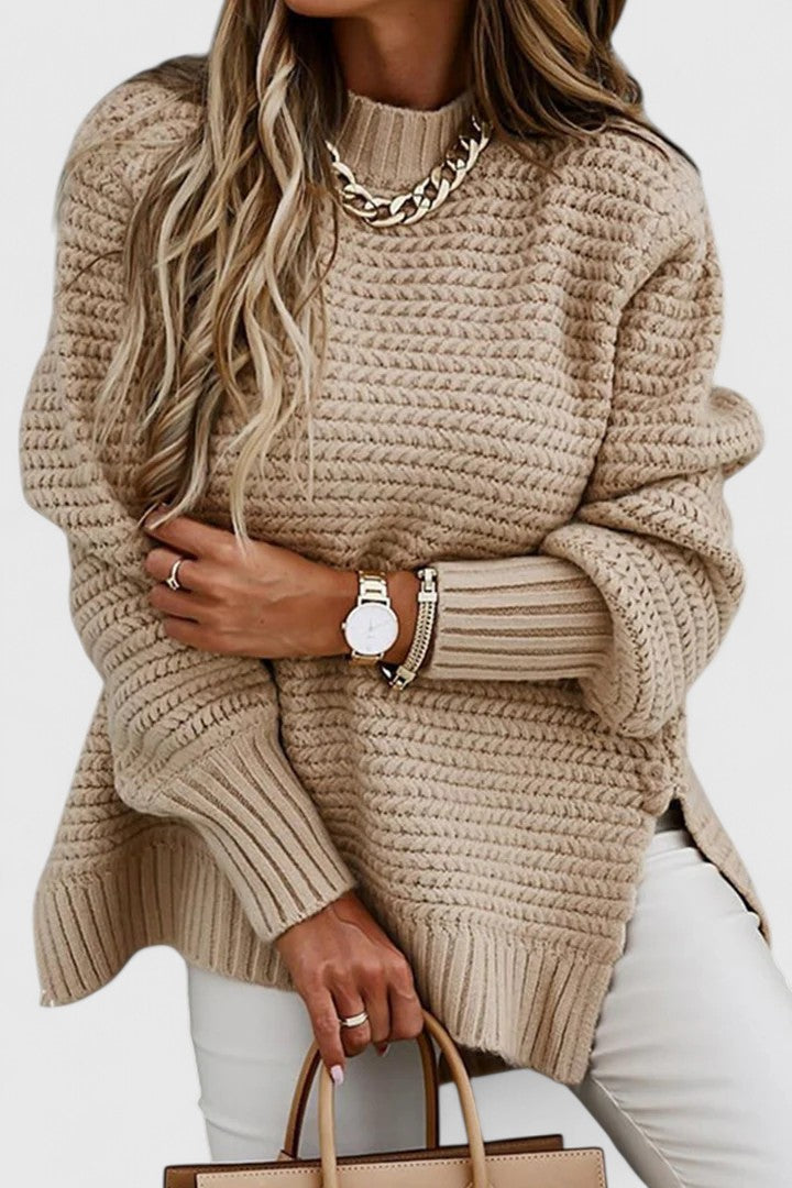 Model wearing a women's chunky ribbed mock neck sweater, showcasing its relaxed fit and elegant winter style.