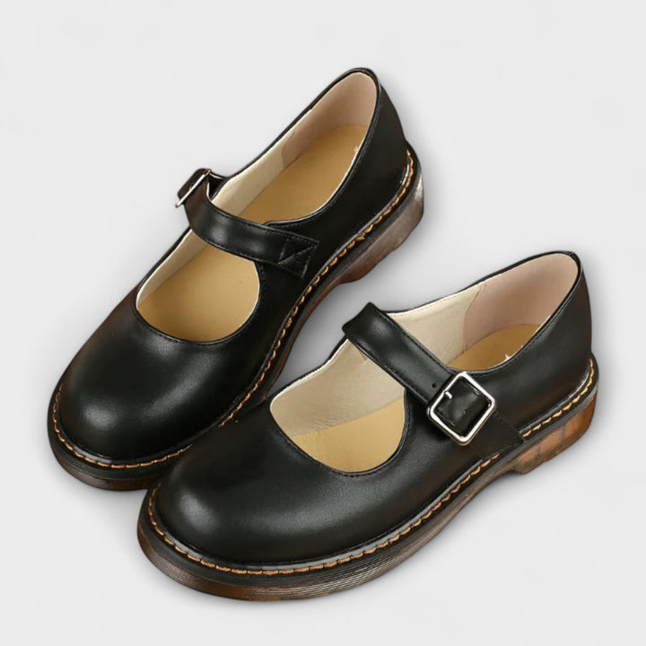 Women's Mary Jane flats with chunky sole, buckle strap, and round toe. Stylish retro everyday footwear.