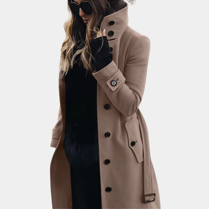 Women's classic beige trench coat with double-breasted design, belt, and elegant long silhouette for fall and spring.