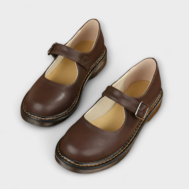 Women's classic black Mary Jane flat shoes with buckle strap; comfortable and versatile for everyday or formal wear.