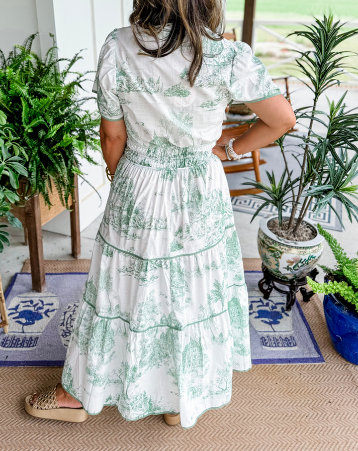 Delicate toile print maxi dress for women, featuring smocked V-neck & tiered skirt. Spring casual elegance.