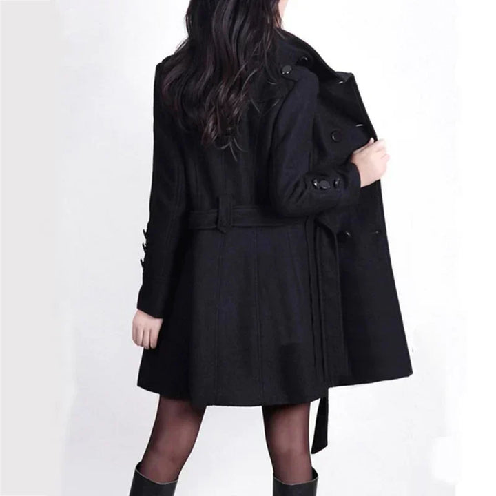 Stylish long double-breasted women's trench coat with belt, great for classic fall & winter outfits.