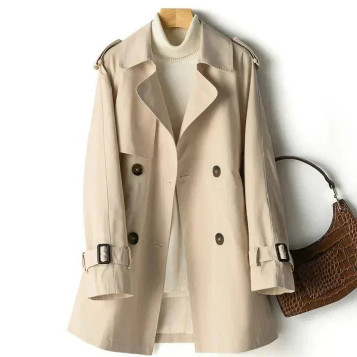 Women's classic double-breasted trench coat with belt & adjustable cuffs. Elegant fall/spring outerwear.