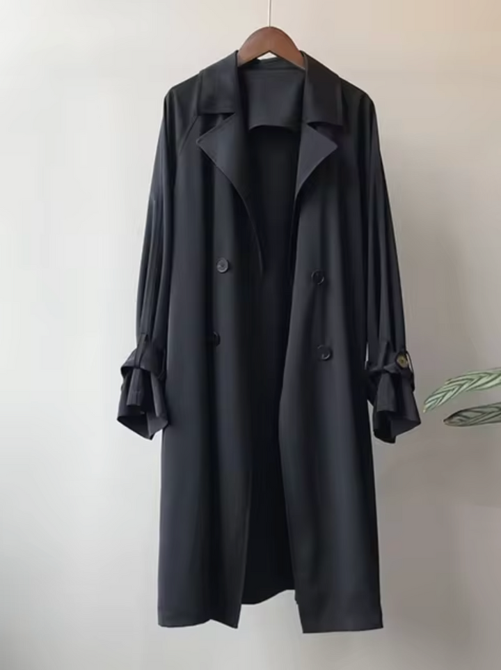 Women's classic double-breasted trench coat with lapel collar. Stylish outerwear for business casual or elegant office attire.
