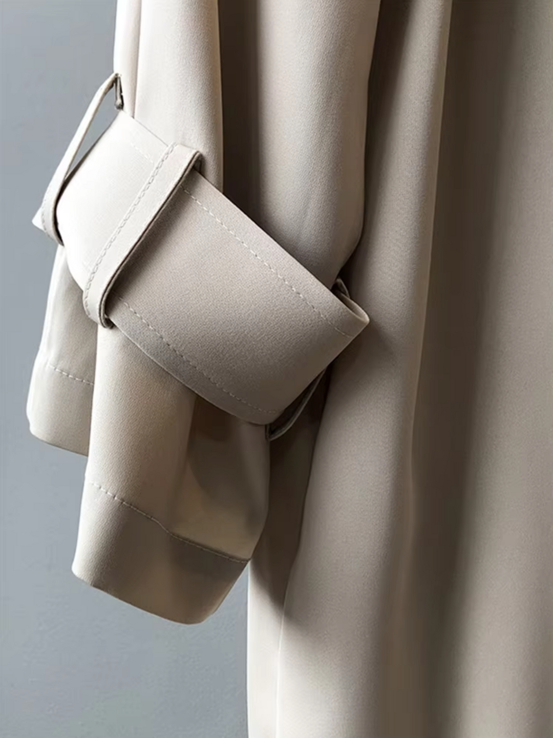 Stay dry & stylish in this women's double-breasted rain trench coat. Classic lapel collar, elegant workwear outerwear.