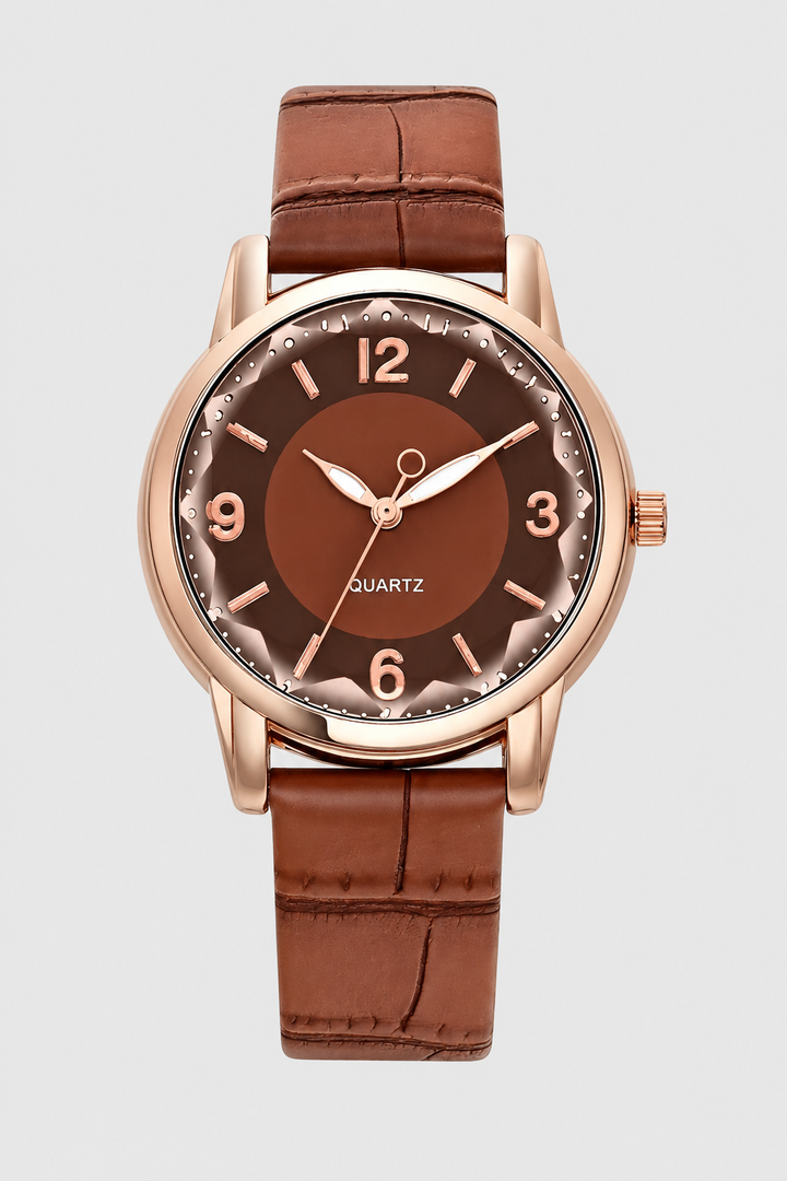 Ladies' minimalist quartz dress watch featuring a timeless design and a detailed embossed leather strap.