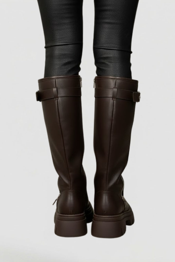 Fashionable women's knee-high platform boots with a comfortable round toe & practical side zipper. Trendy winter footwear.