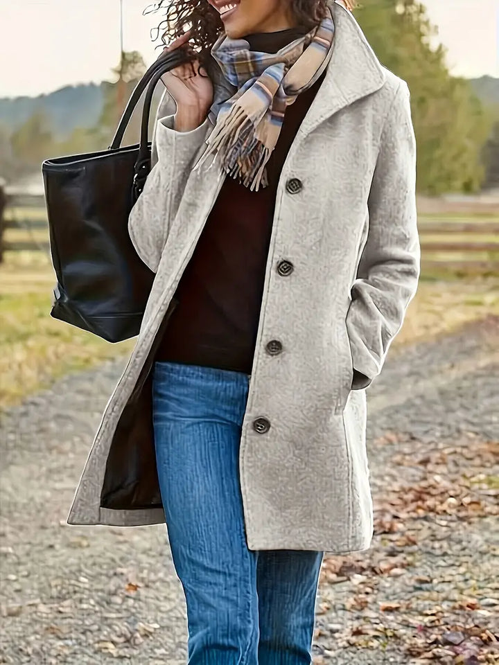 Women's classic lapel trench coat with button front, ideal for elegant fall outerwear and stylish looks.