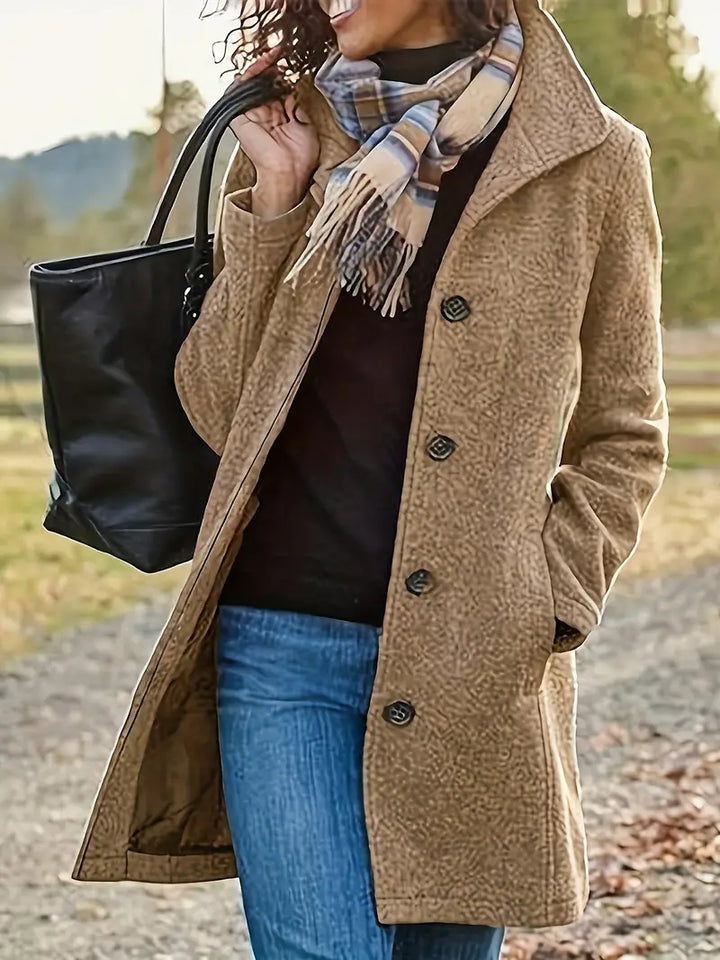Elegant women's button-front trench coat with lapel, perfect for a layered look in fall & winter.
