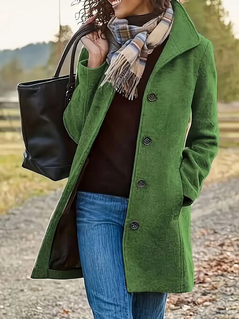 Classic women's outerwear: mid-length trench coat with a prominent lapel and stylish button-front design.
