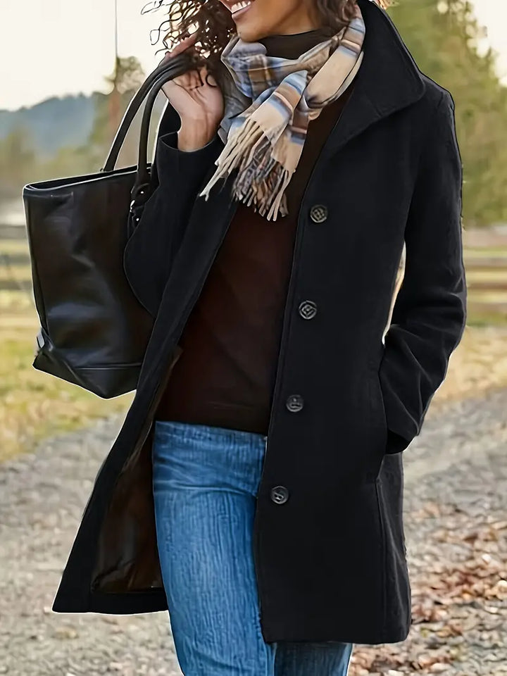 Women's classic trench coat. Button-front, lapel collar, elegant mid-length design for fall and winter fashion.