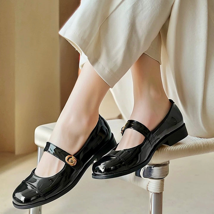 Stylish patent Mary Jane flats for women, designed with a wide toe box and strong arch support.