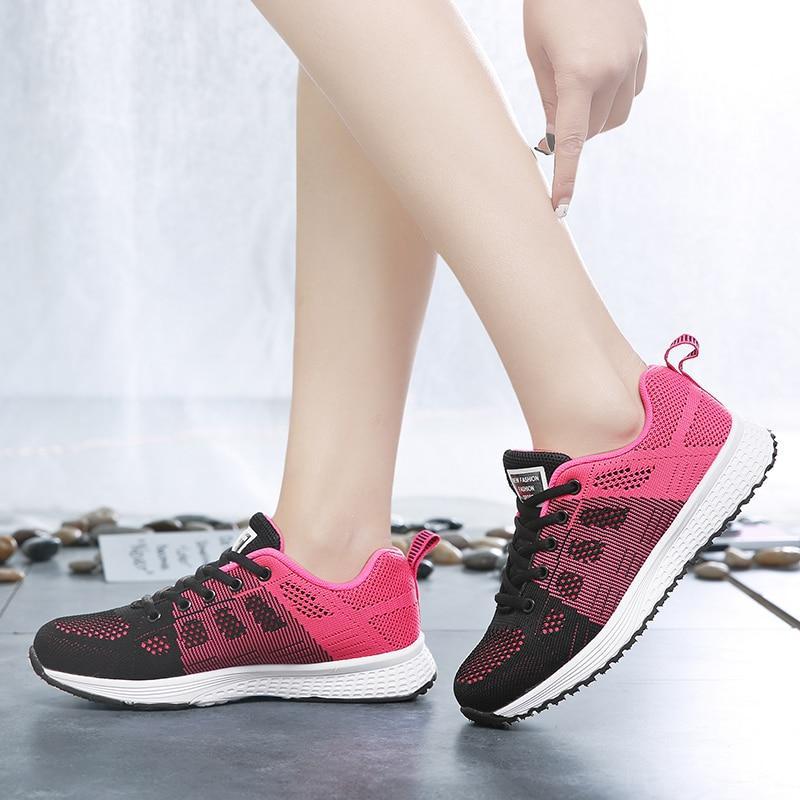 Side view: Grey women's walking shoes, breathable, with arch support for active lifestyle.