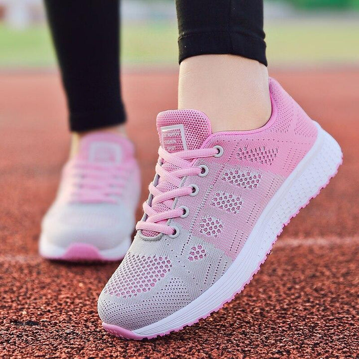 Close-up: Breathable mesh of women's walking shoes, ideal for foot comfort & active wear.