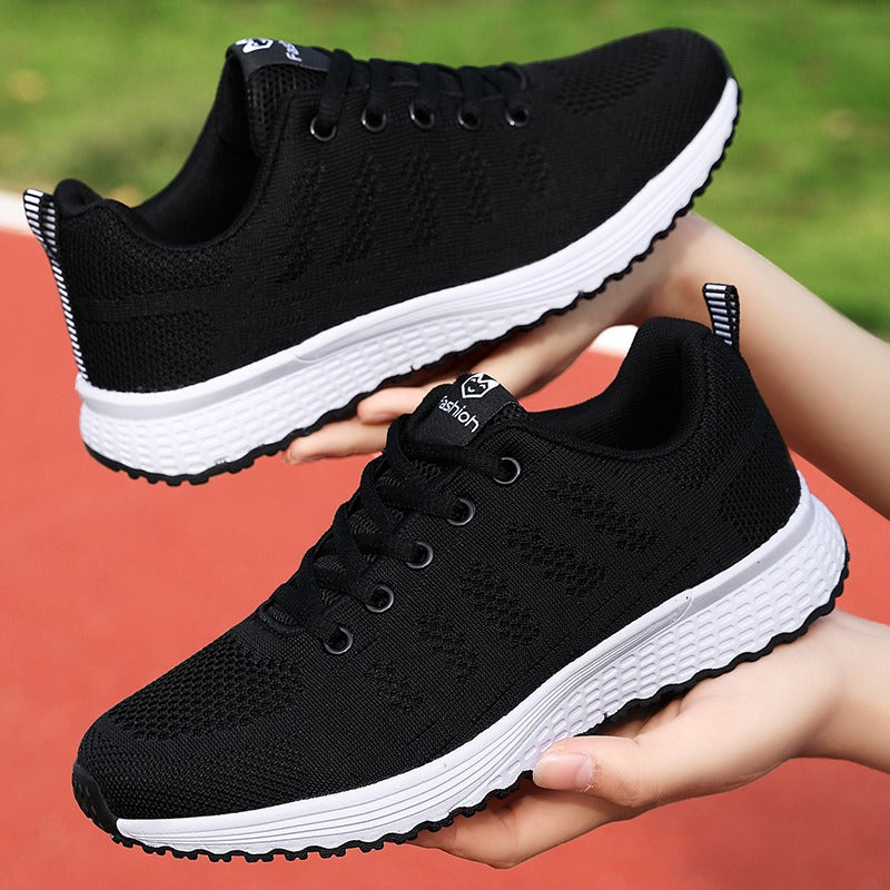 Pair of women's classic orthopedic shoes, black, ready for everyday walking comfort.