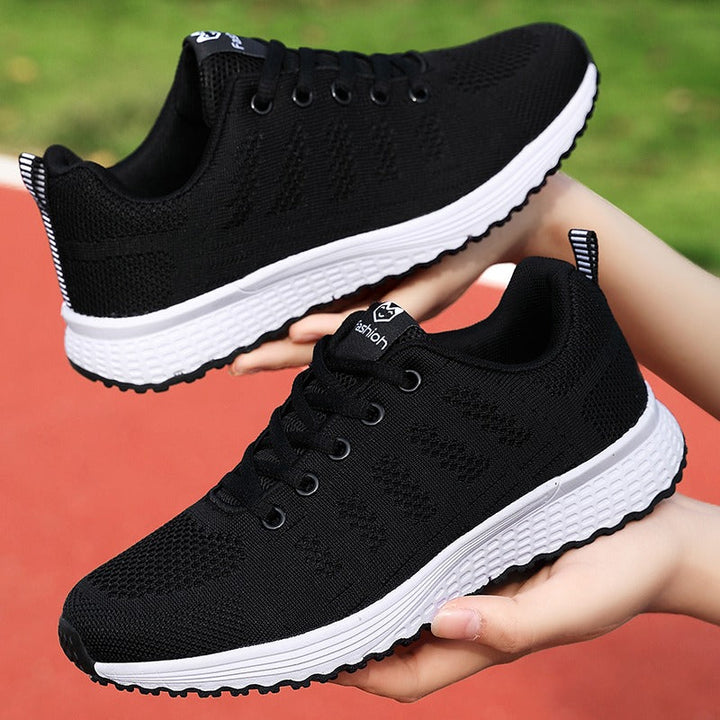 Pair of women's classic orthopedic shoes, black, ready for everyday walking comfort.