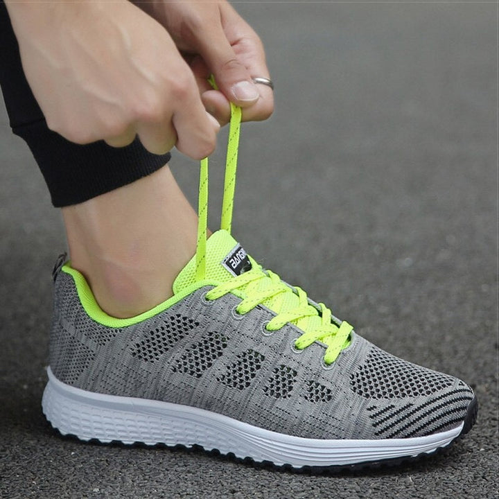 Pair of women's orthopedic walking shoes, grey, for comfortable active lifestyle.