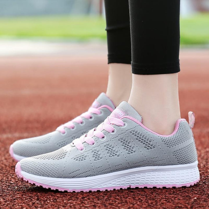 Comfortable women's walking shoes, black, providing essential foot support & cushioning.