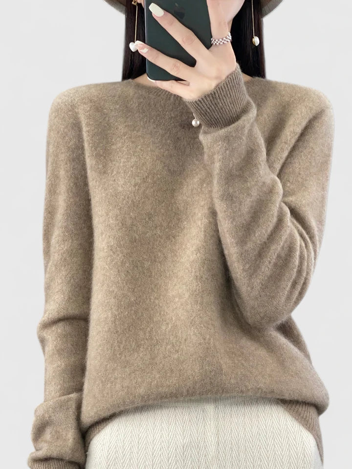 Soft knit women's round neck pullover sweater, close-up of premium fabric texture.