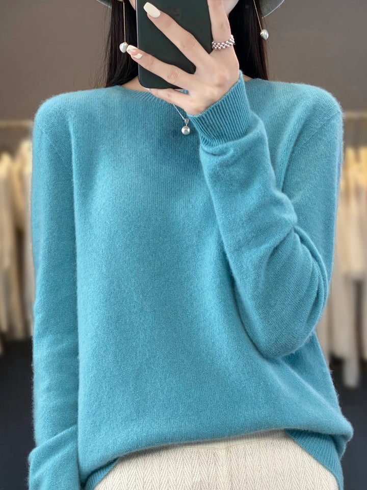 Folded women's long sleeve pullover sweater, cozy knitwear for fall fashion.