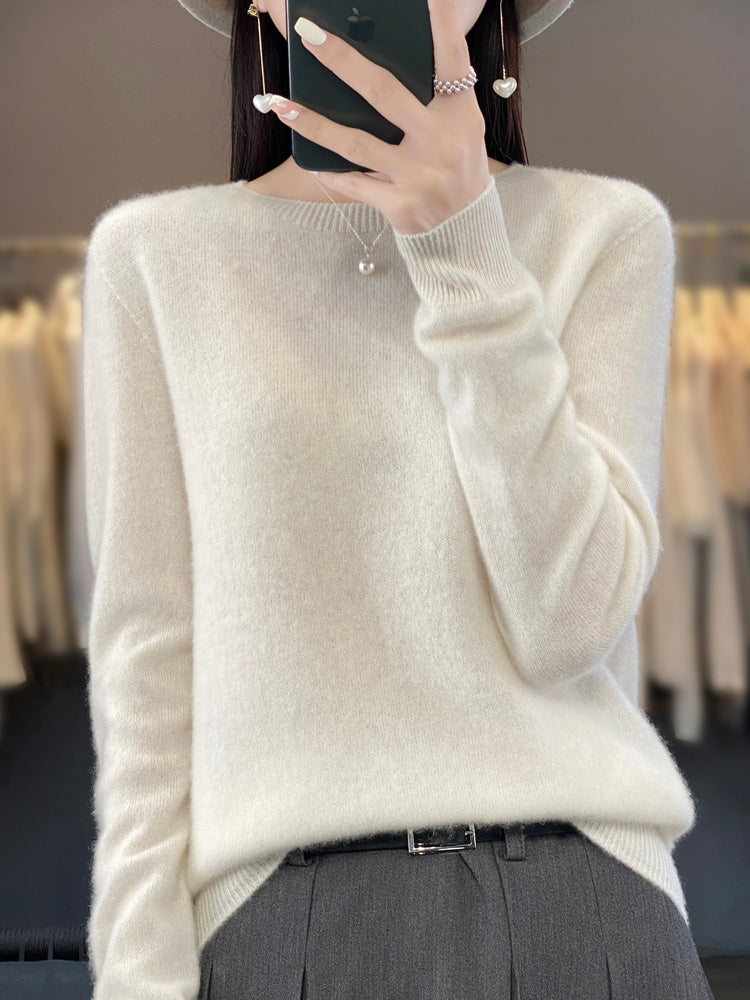 Woman in classic round neck sweater & jeans, casual and cozy fall fashion outfit.