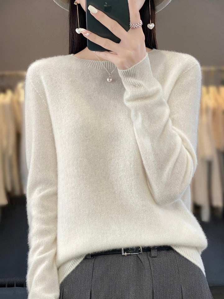 Woman in classic round neck sweater & jeans, casual and cozy fall fashion outfit.