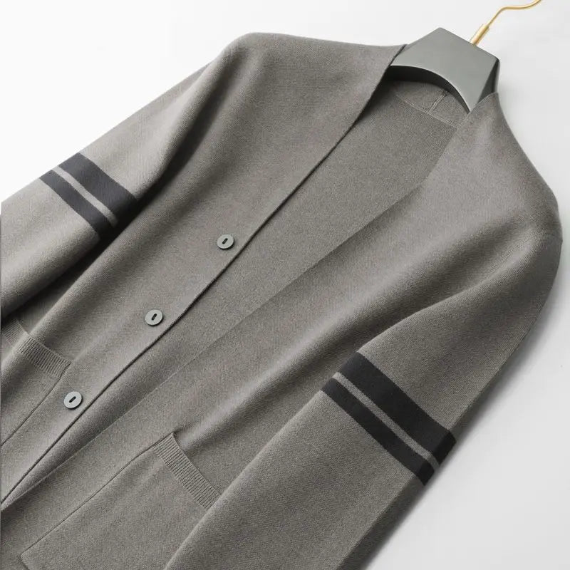 Stylish women's striped cardigan, a fall fashion essential & versatile winter layering piece for comfort.
