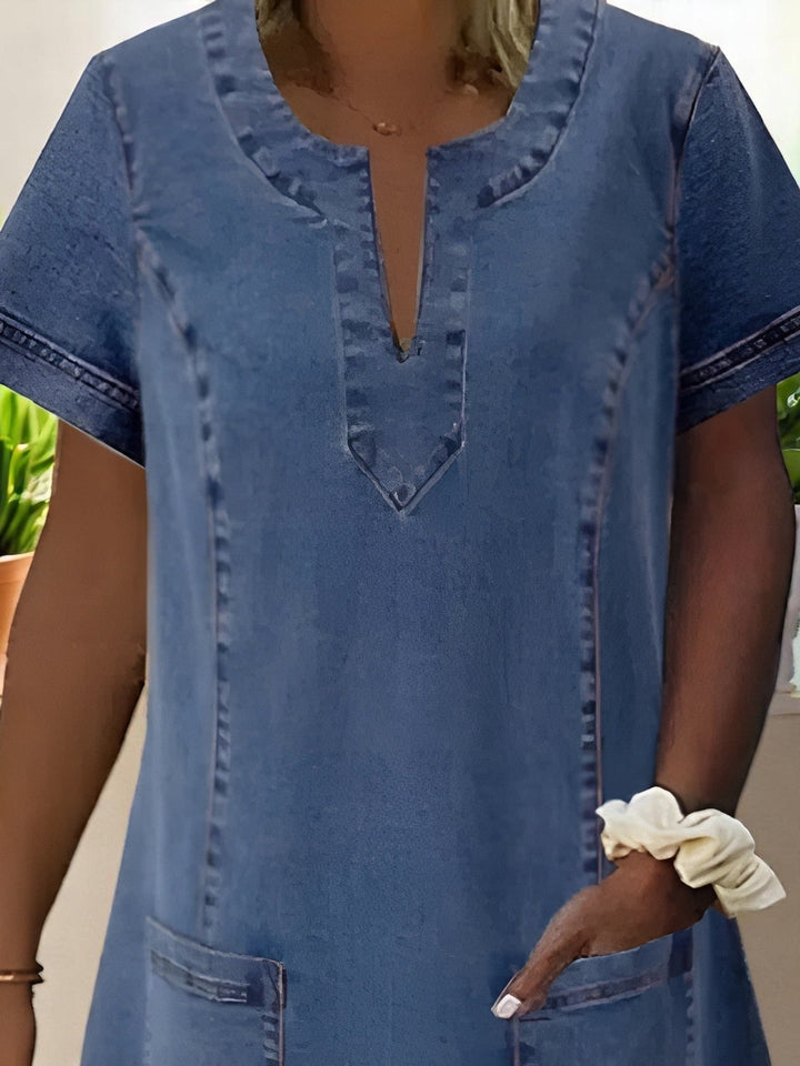 Stylish women's casual dress with a classic design. Comfortable, relaxed fit, perfect for summer. Features practical pockets.