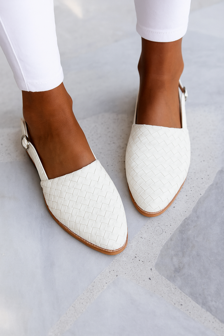 Modern women's slip-on closed-toe mules, flat for comfort. Backless casual footwear for daily wear.