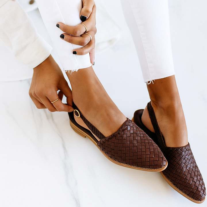Easy slip-on women's mules, closed toe flat design. Offers modern style & everyday comfort footwear.