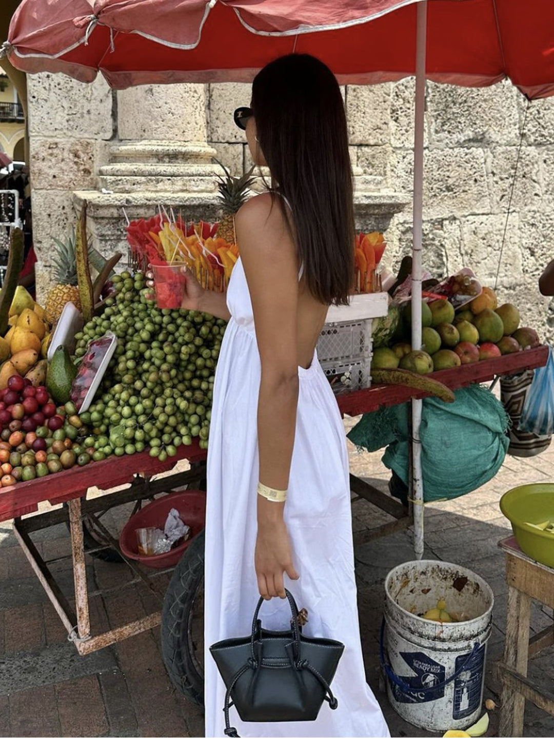 White women's Coastal Cowgirl open back flowy maxi dress. Perfect sleeveless beach or vacation wear.