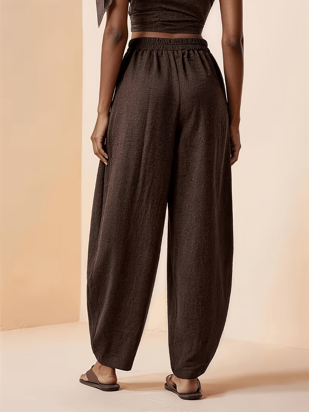 Elegant coffee brown pleated harem pants for women, offering a relaxed fit and high waist, perfect for travel & leisure.