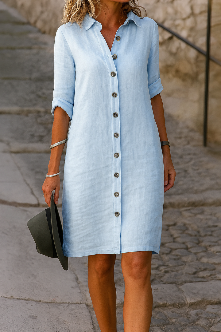 Women's versatile collared button-front dress with roll-tab sleeves, suitable for casual & stylish.