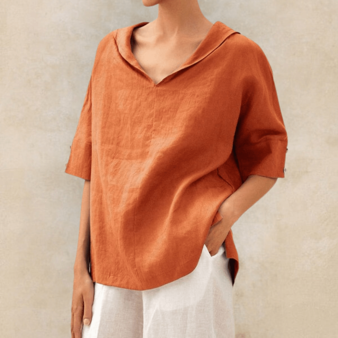 Effortless style with this women's v-neck collared tunic top. Relaxed fit long shirt perfect for casual everyday fashion.