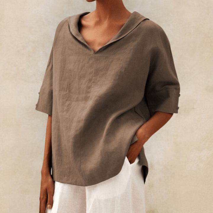 Stylish women's collared v-neck tunic top, a comfortable and versatile long shirt for relaxed everyday wear.