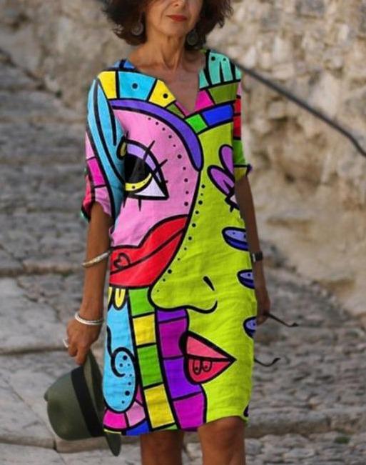 Women's colorful abstract art V-neck midi dress with unique print, a relaxed fit statement piece for holiday fashion.