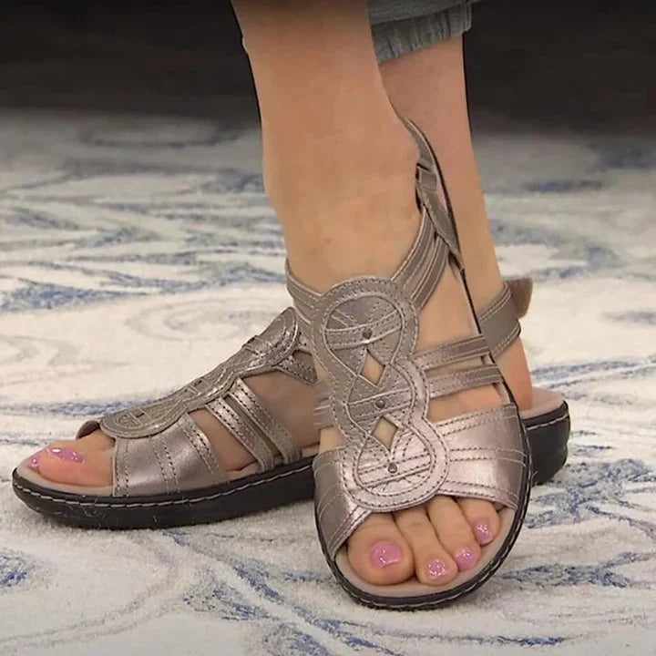 Comfortable women's flat sandals with supportive arch & open toe. Easy slip-on style for all-day casual summer wear.