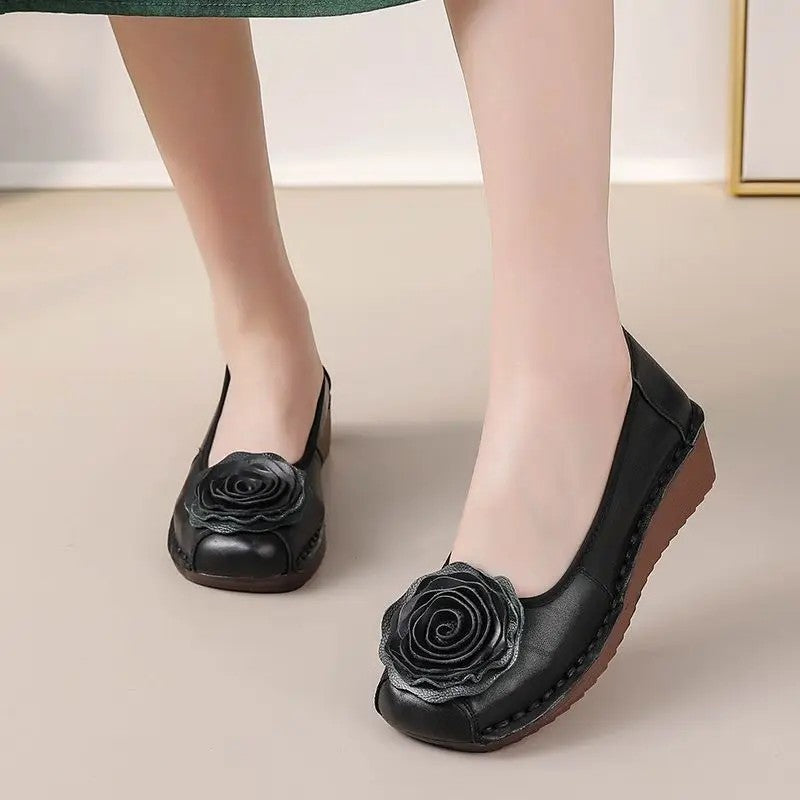 Casual women's loafers with unique floral appliqué. Slip-on for convenience and all-day comfort.