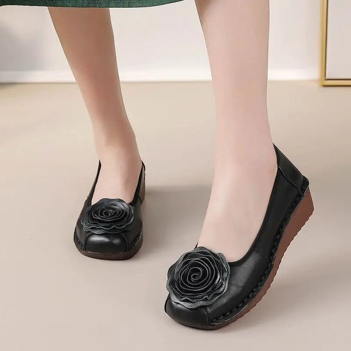 Casual women's loafers with unique floral appliqué. Slip-on for convenience and all-day comfort.