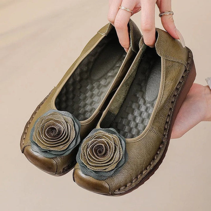 Side view of women's comfort loafer. Chic floral appliqué and easy slip-on style for spring/summer.