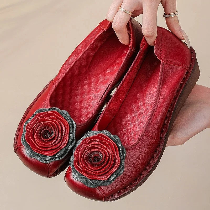 Elegant women's comfort loafers with a distinct floral appliqué. Slip-on design for ultimate ease.