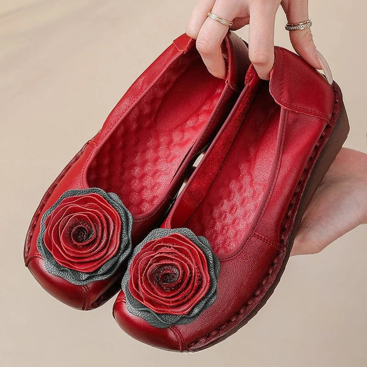 Elegant women's comfort loafers with a distinct floral appliqué. Slip-on design for ultimate ease.
