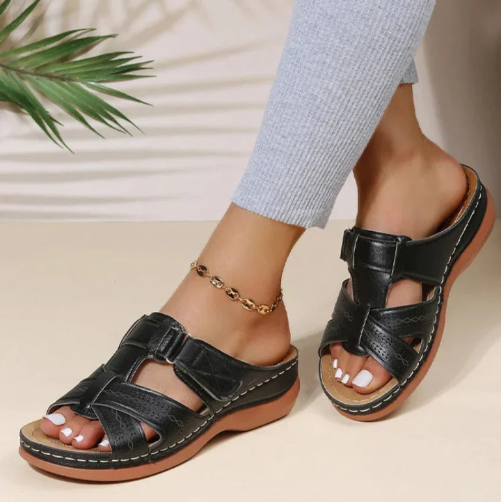 Side view of women's orthopedic walking sandals, showcasing arch support & adjustable strap for comfort.