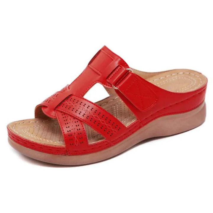 Woman wearing comfort orthopedic sandals, ideal for walking, offering arch support & all-day comfort.