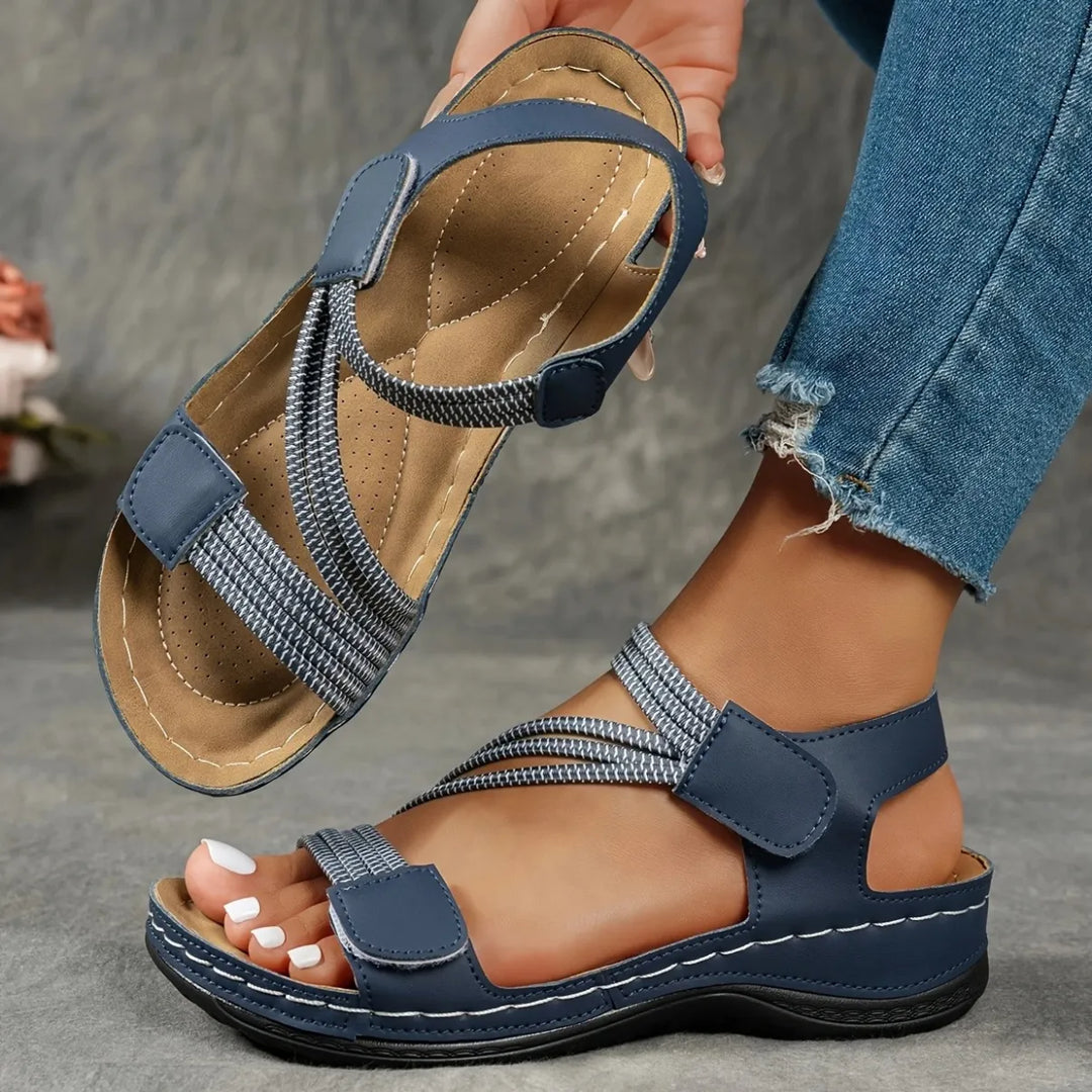 Women's comfort footwear with elastic adjustable straps and a plush cushioned insole for ultimate support.