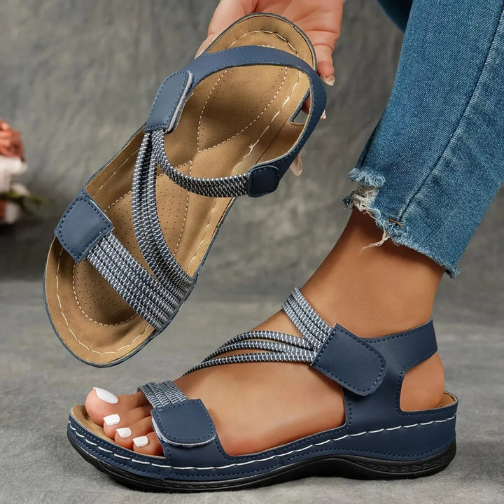 Women's comfort footwear with elastic adjustable straps and a plush cushioned insole for ultimate support.
