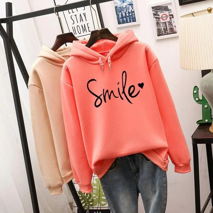 Comfortable women's hoodie featuring a cheerful smile graphic, ideal for cozy everyday fashion.